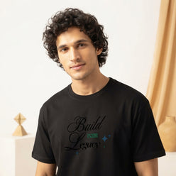 Kabir Das wearing a black brush-style inspirational quote T-shirt in a professional editorial portrait.
