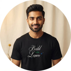 A professional portrait of a man wearing a black t-shirt with a white brush-style inspirational quote against a cream backgro